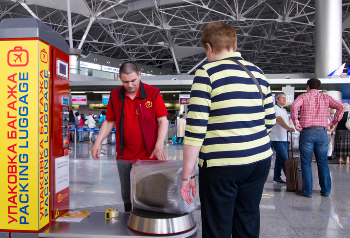 People at the luggage rack package at Vnukovo airport