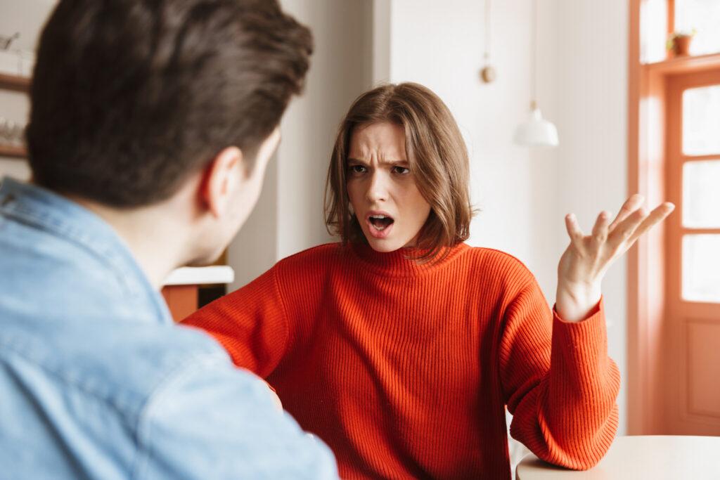Angry young woman having an argument with her boyfriend