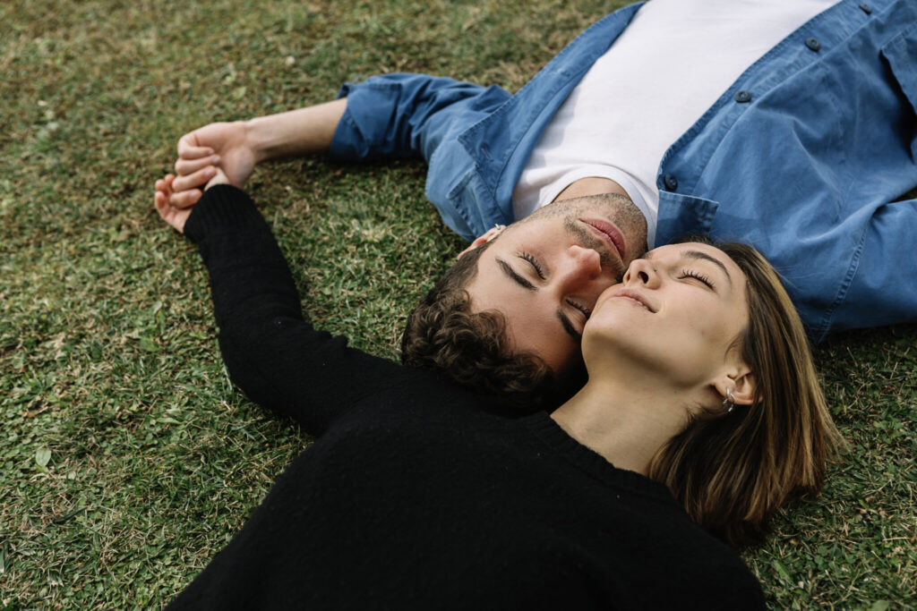 Smiling couple lying on lawn
