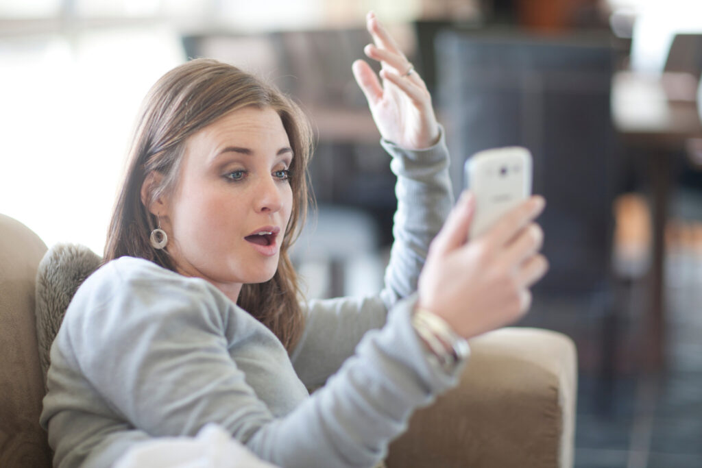 Young woman using cellphone for video call
