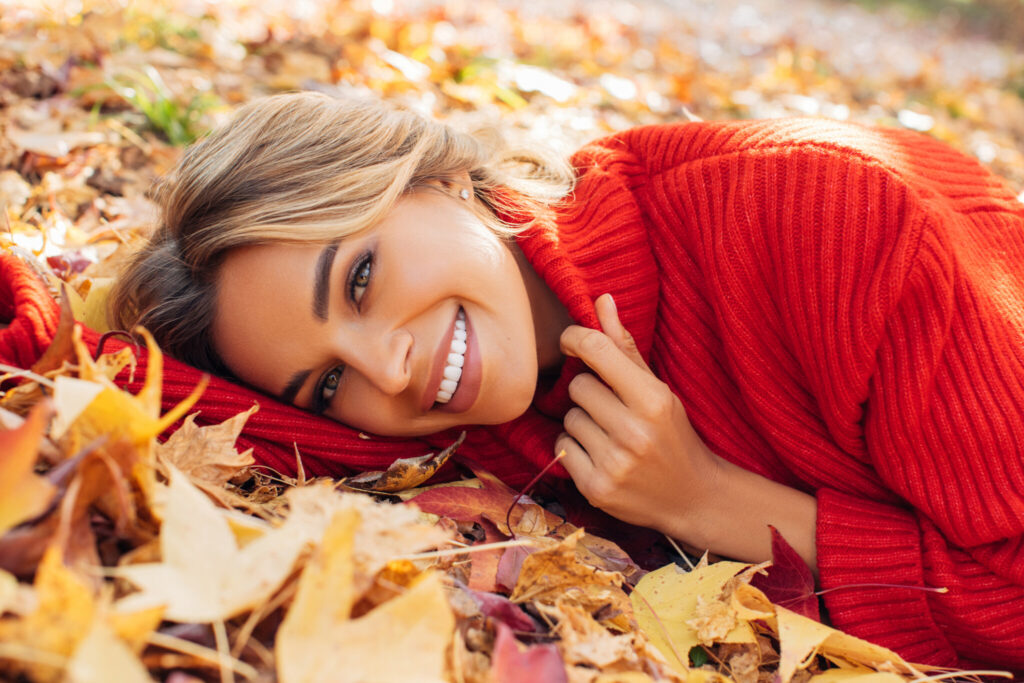 Beautiful woman lying on leaves