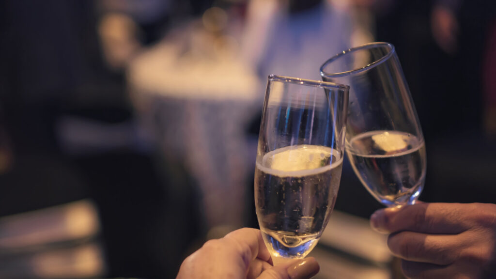 Couple Toasting with Champagne at Party