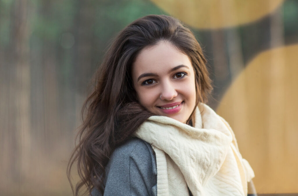 Portrait Of Smiling Young Woman Outdoors