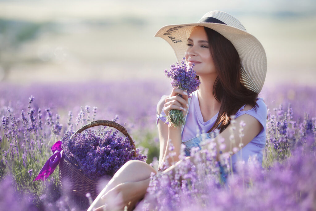 Pregnant woman in lavender field on summer day