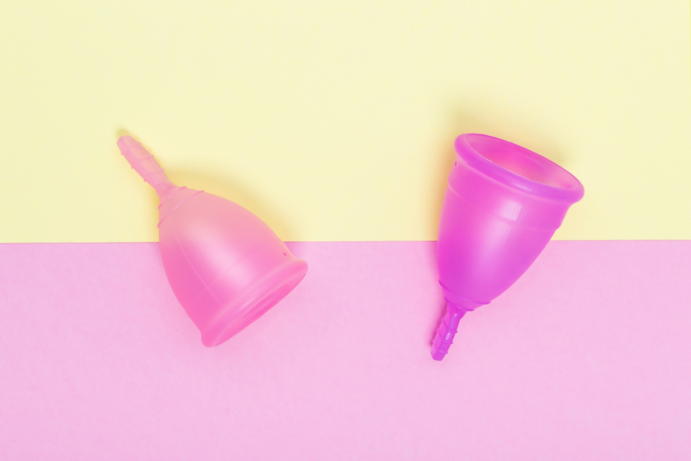 Pink,Menstrual,Cup,On,Color,Background,,Female,Intimate,Hygiene,Period